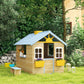 Kids wooden playhouse with blue roof, front door, two windows, and yellow flower pots