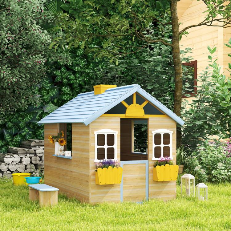Kids wooden playhouse with blue roof, front door, two windows, and yellow flower pots