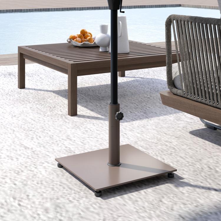 Brown square metal patio umbrella base with central pole stand and leveling foot pads