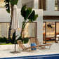 Square umbrella stand base with vertical pole on outdoor patio near pool water