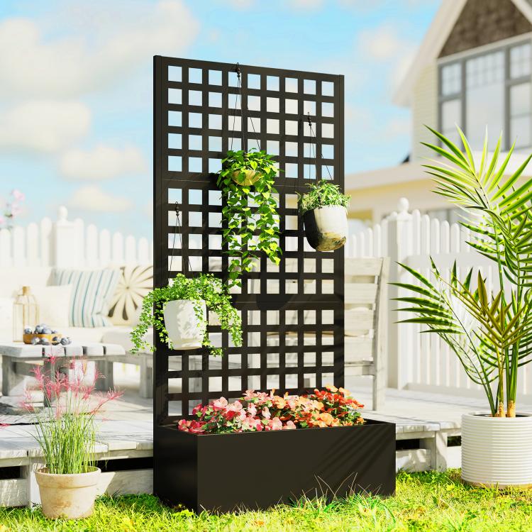 Black raised garden planter with tall trellis panel holding flowers and vines