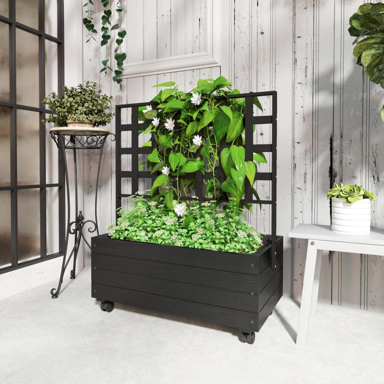 Raised garden bed planter with trellis and wheels, overflowing herbs and leafy plants