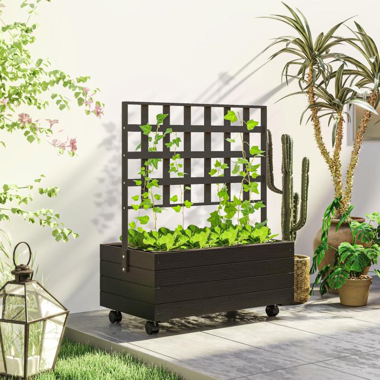 Raised garden bed planter with trellis and wheels on outdoor patio, leafy plants inside