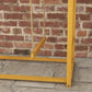Wooden activity center base with thick legs and rope swing attachment