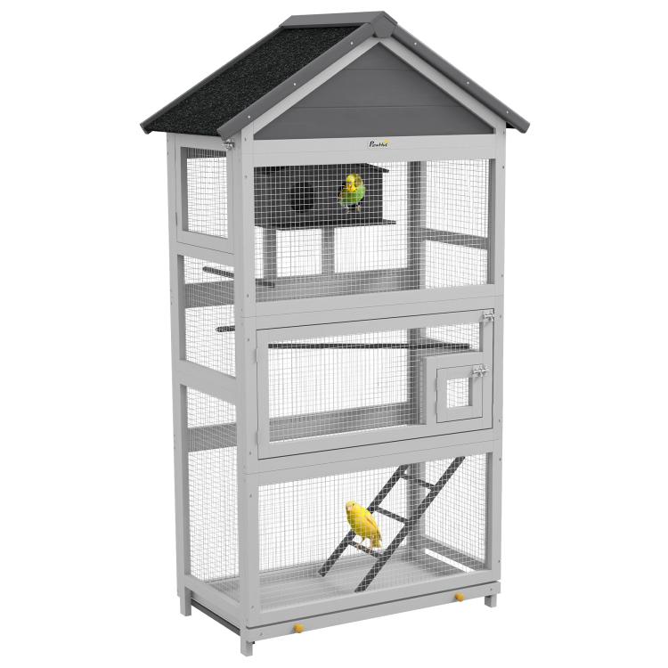 Gray wooden bird aviary with wire mesh, perches, and ladder under sloped roof