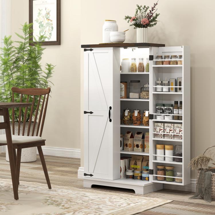 White pantry cabinet with barn-style door and open interior shelving compartments