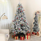 Flocked prelit artificial Christmas tree with clear lights and multicolor ball ornaments