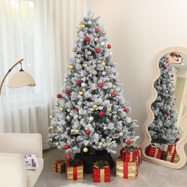 Flocked prelit artificial Christmas tree with clear lights and multicolor ball ornaments
