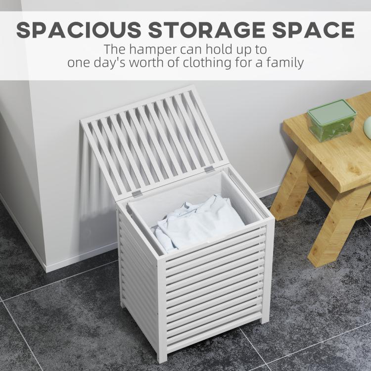 White slatted bamboo laundry hamper with open lid and folded clothes inside