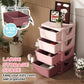 Pink kids 4-tier dresser tower showing four drawer compartments