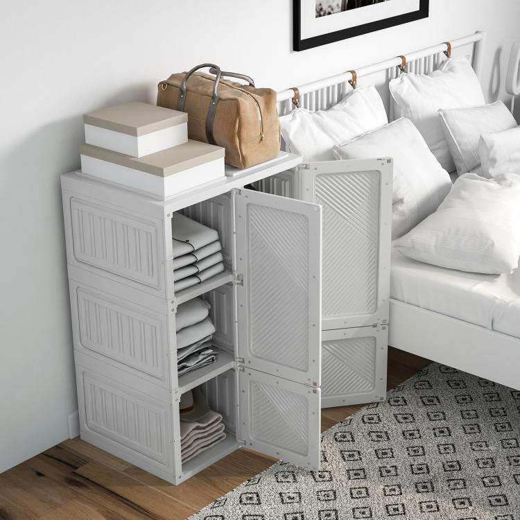 White foldable wardrobe storage organizer with hanging rod, open doors, and stacked shelves