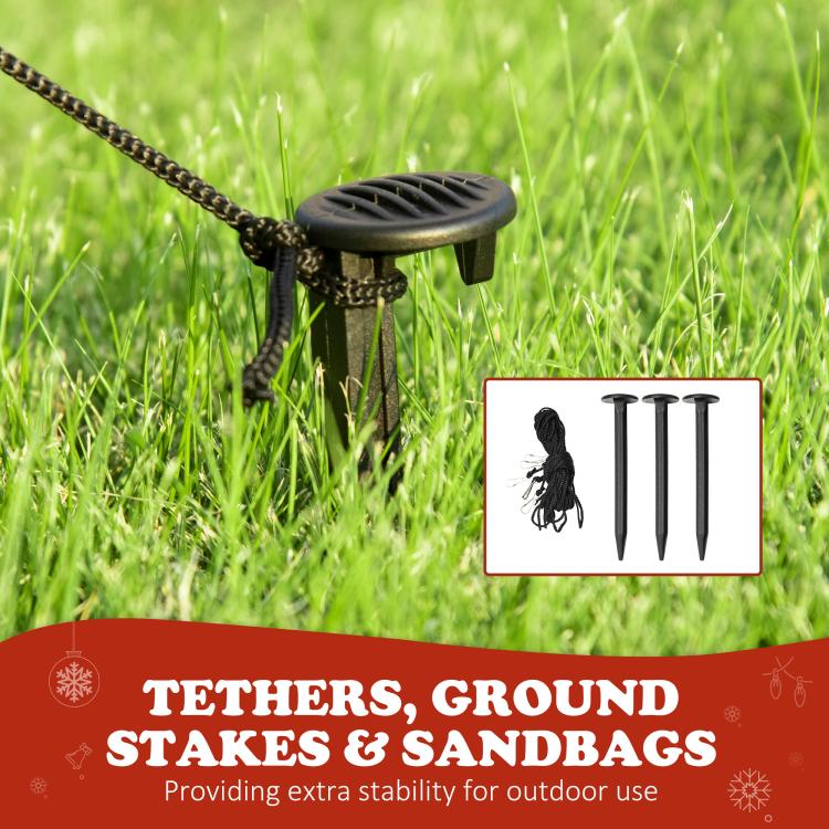 Inflatable Santa yard stakes and tethers shown on grass for outdoor stability
