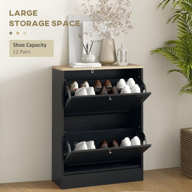 Black shoe storage cabinet open, showing shoe compartments behind flip drawers