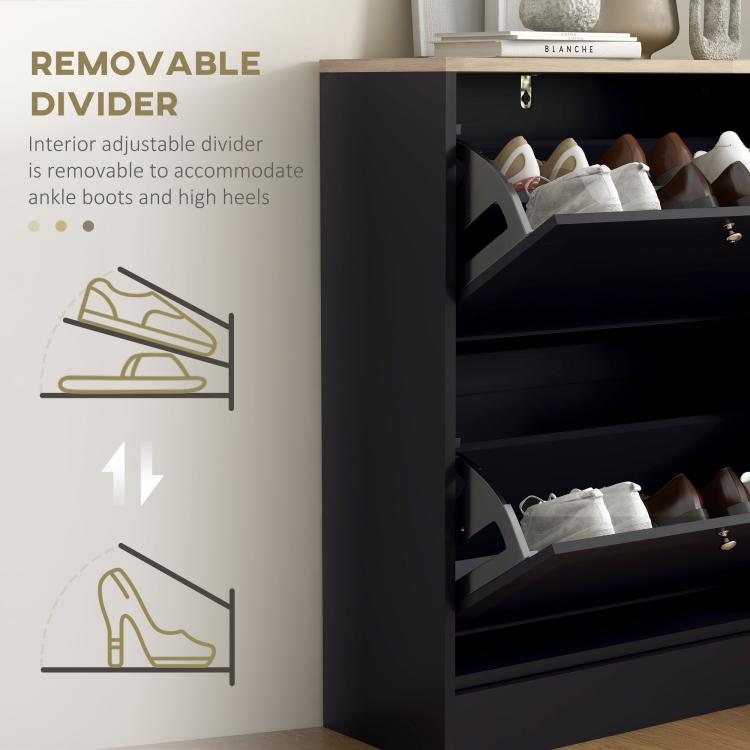Open black shoe cabinet with visible removable divider between shoe compartments