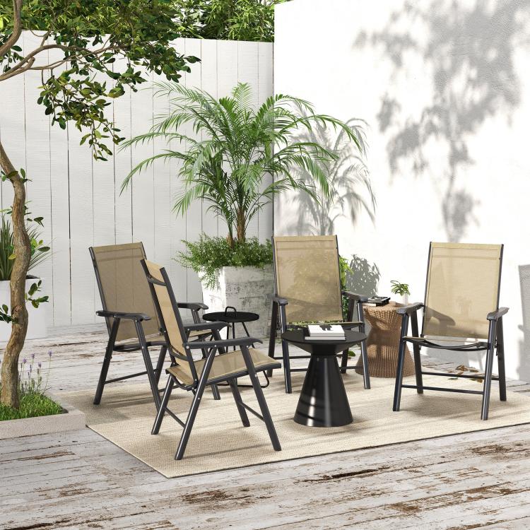 Set of four outdoor folding chairs with armrests, light mixed brown mesh seats on patio