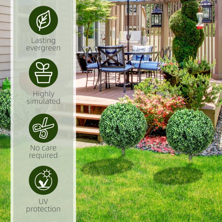 Artificial boxwood ball topiary tree with dense green foliage on a ground stake