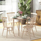 Round drop-leaf dining table with light oak finish and four wooden legs in a dining set
