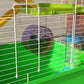 Green hamster cage enclosure with front door bars and purple exercise wheel detail