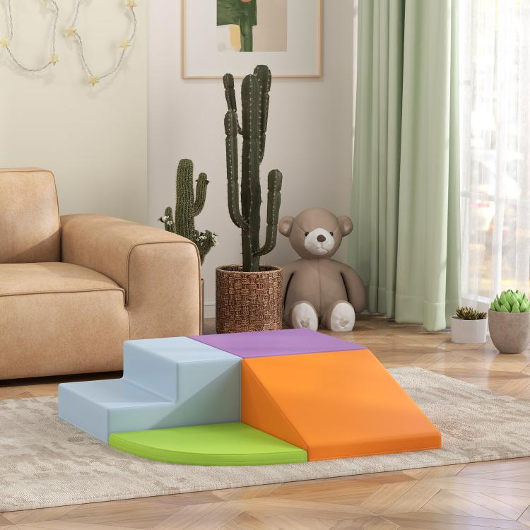 Multicolor foam play set with blue base, purple top and orange ramp, on rug