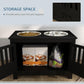 Black dog feeding station cabinet with two bowls and open storage shelf for pet food bag
