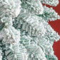 Snow-flocked slim pencil artificial Christmas tree branches, dense white coating