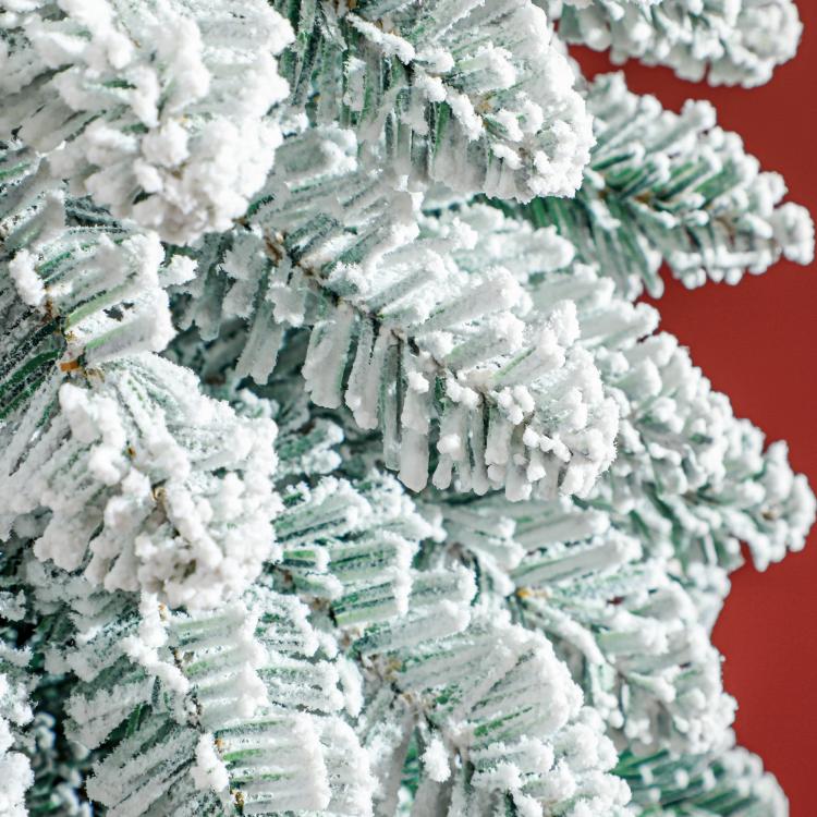 Snow-flocked slim pencil artificial Christmas tree branches, dense white coating