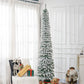 Snow-frosted slim artificial Christmas tree with dense branches, upright on stand
