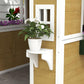 Kids wooden playhouse side with white planter shelf and pot on beige panel wall