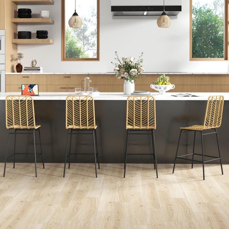 Set of 4 rattan bar stools with tan woven seats and black steel legs at a kitchen bar