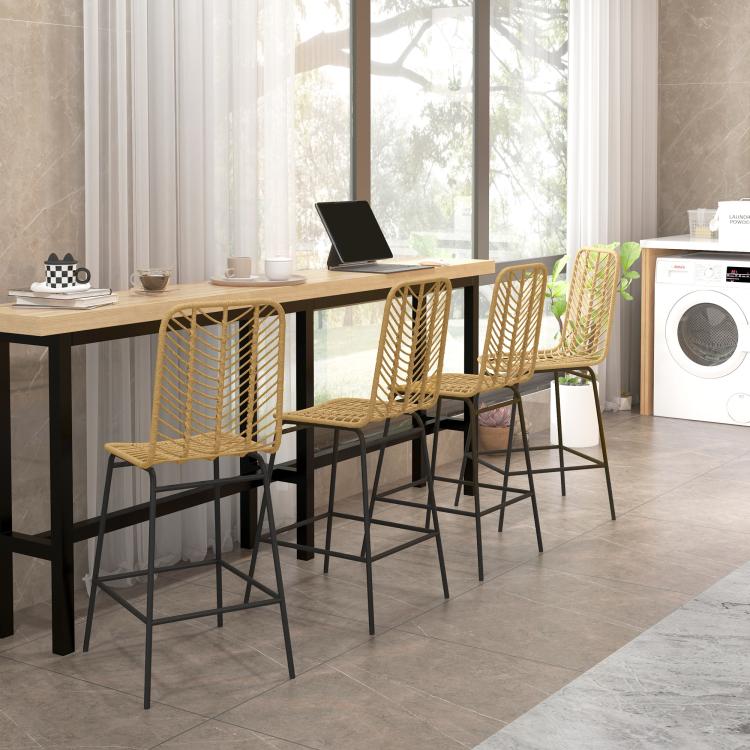 Set of rattan dining bar stools with woven seats and black steel legs around a table