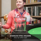 Poker table cup holder on black rim beside green felt surface