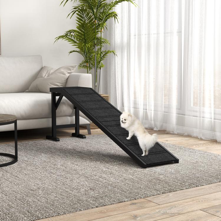 Black dog ramp with textured non-slip carpet, white dog on ramp near living room