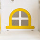 Close-up of yellow arched window panel on white toddler slide and swing playset