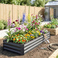 Dark gray raised galvanized garden bed lined with blooming flowers and greenery