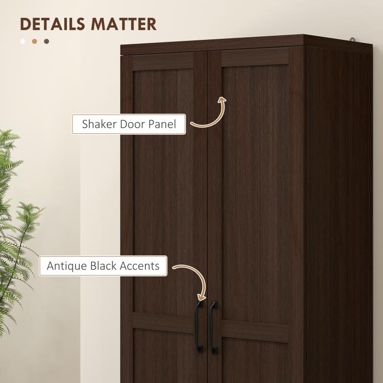 Pantry doors feature shaker panels with antique black accents and curved metal pulls.