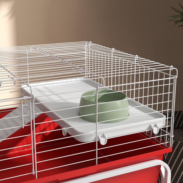 Two-story small animal cage with red base, white wire bars, green food bowl