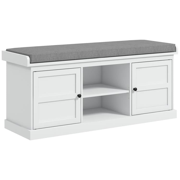 White shoe storage bench with gray cushioned top and two open cabinet doors