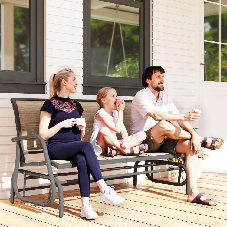 Patio porch glider swing bench with brown mesh back and dark arms for three people