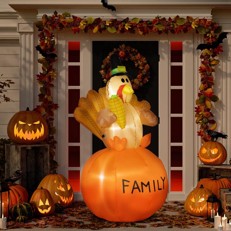 Lit orange inflatable turkey with pilgrim hat and “FAMILY” printed on the belly.