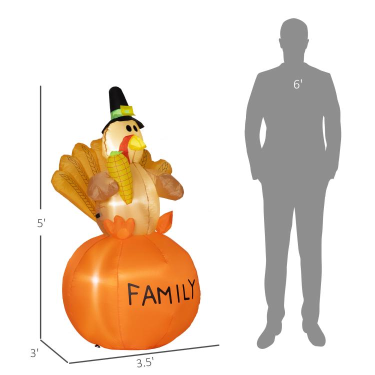 Orange inflatable turkey with pilgrim hat; height markers show 4.9 ft size.