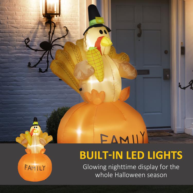 Orange inflatable turkey with pilgrim hat, glowing LEDs, and “FAMILY” text on belly.