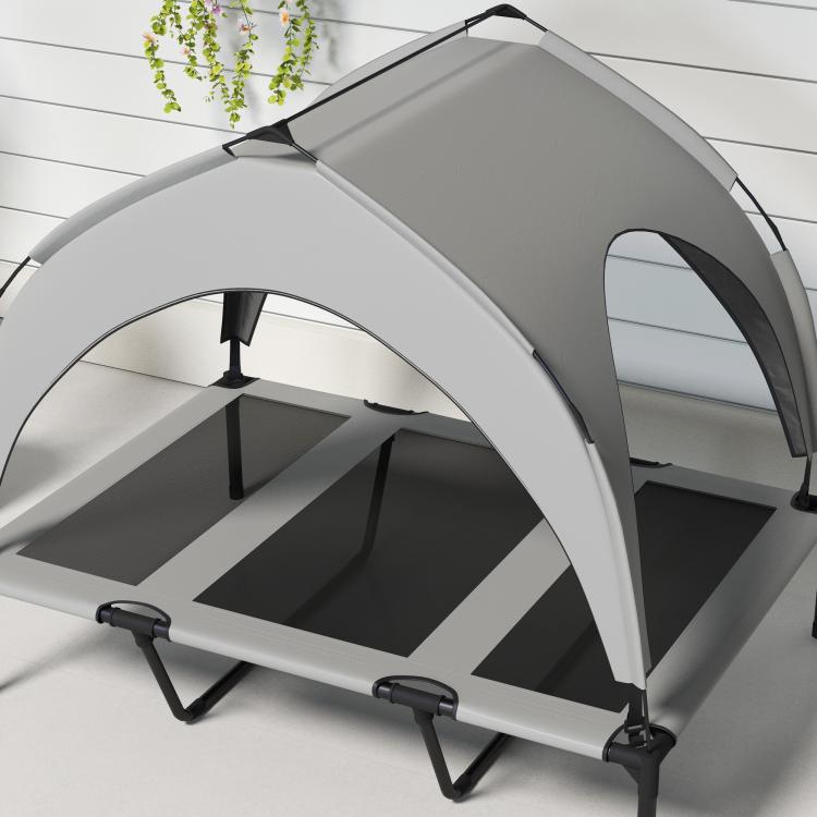 Close-up of gray canopy dog bed with black legs and mesh side panels, raised cot