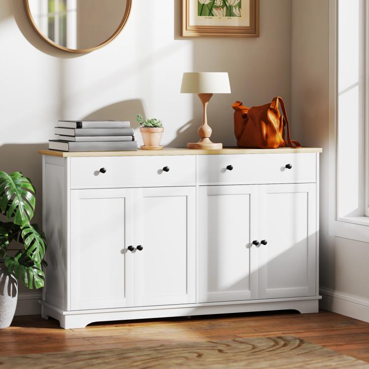 White sideboard cabinet with light wood top and four cabinet doors for storage