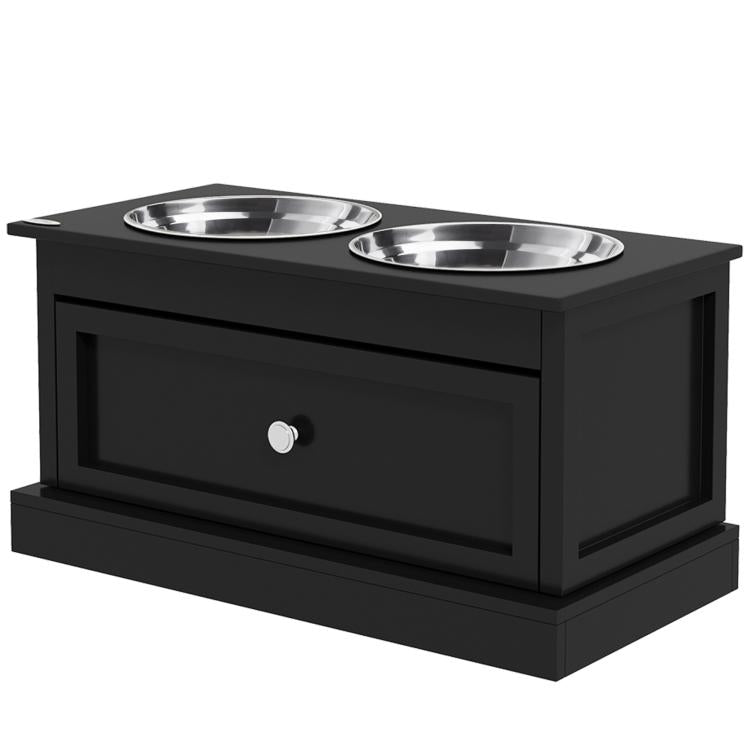 Black elevated dog feeding station with two stainless steel bowls and drawer front