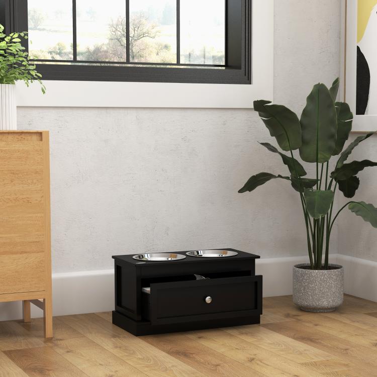 Black elevated dog bowl stand with two stainless bowls and storage drawer