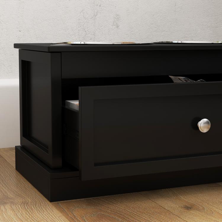 Black raised dog feeding stand with drawer open and stainless steel bowls on top