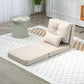 Beige convertible floor sofa bed with upright back cushion and two pillows