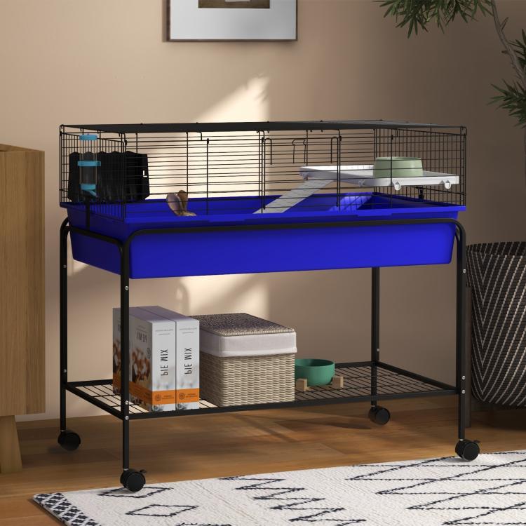 Blue two-story small animal cage with wire bars and lower shelf on wheeled frame