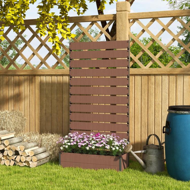 Light brown trellis planter panel beside yard fence with flower-filled raised bed