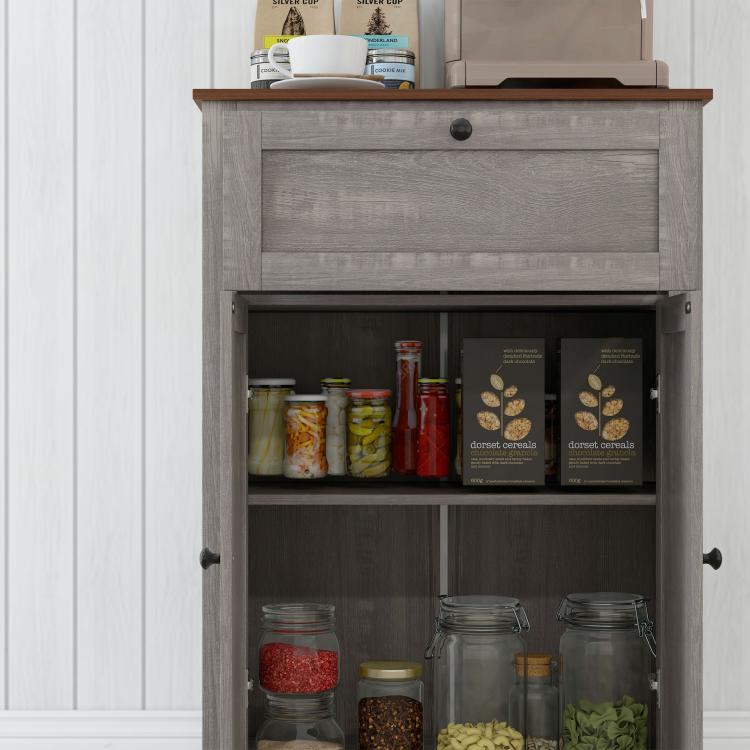 Open gray sideboard cabinet with shelves holding pantry jars and boxes